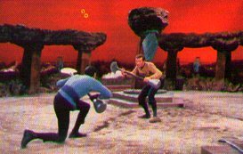 Kirk and Spock surround each othr with lirpas
